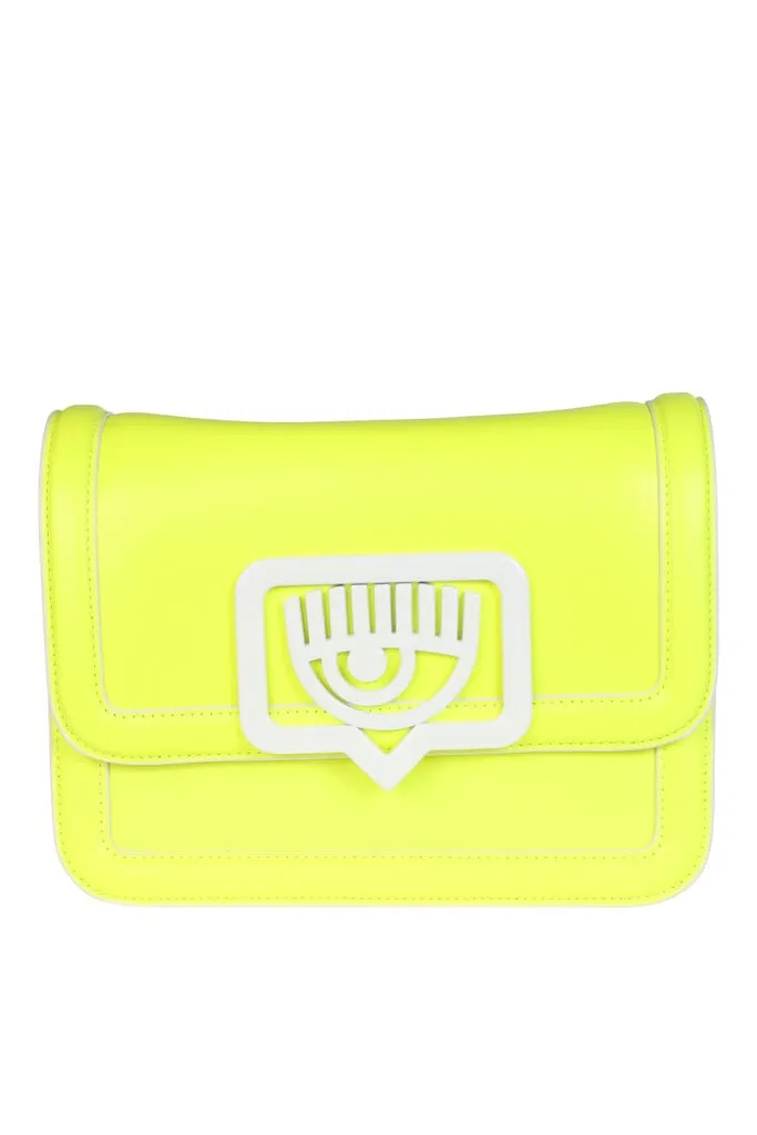 Bolso bandolera amarillo fluor con logo ojo en metal