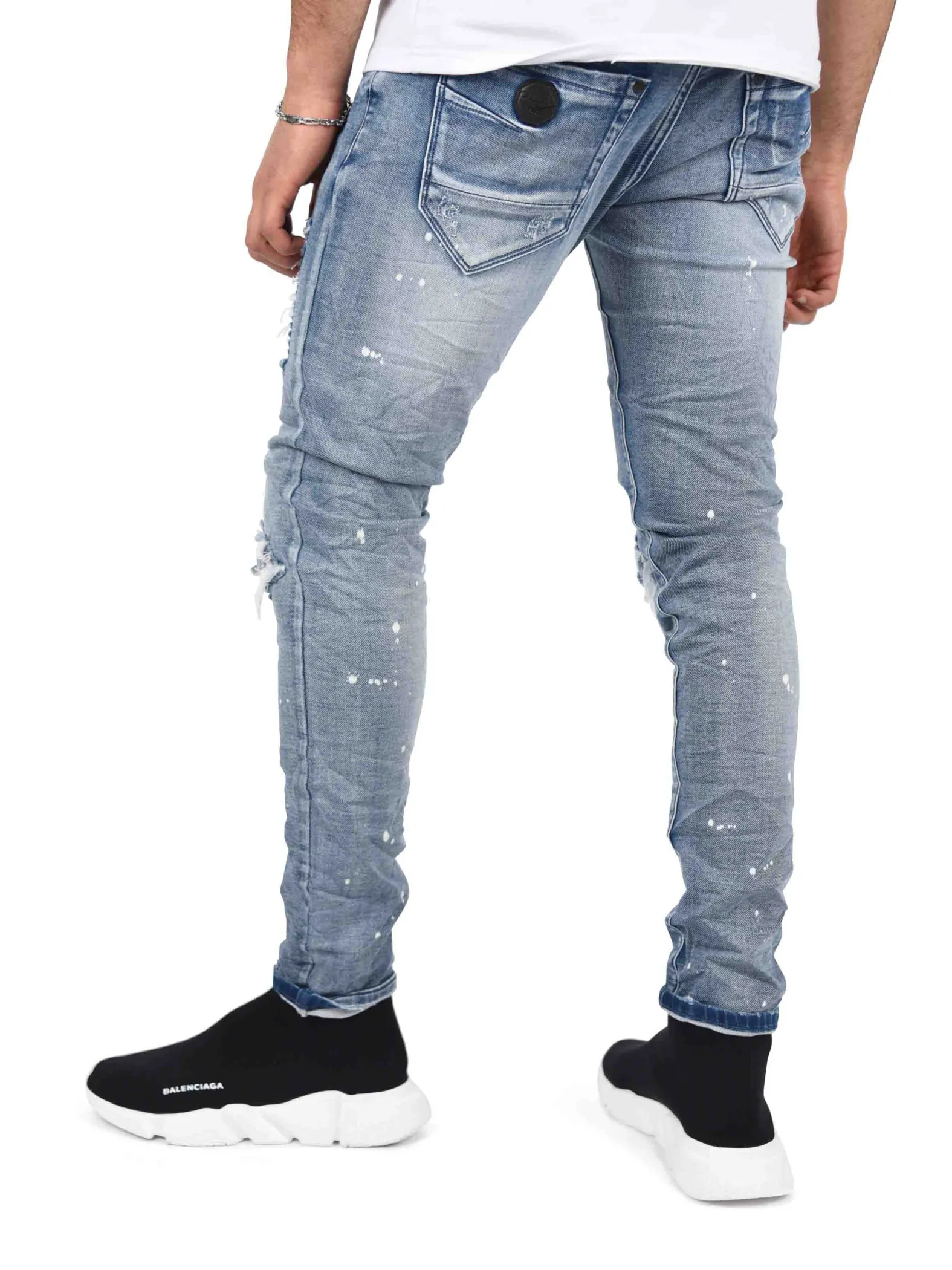 Jeans pitillo elásticos con lavado jaspeado