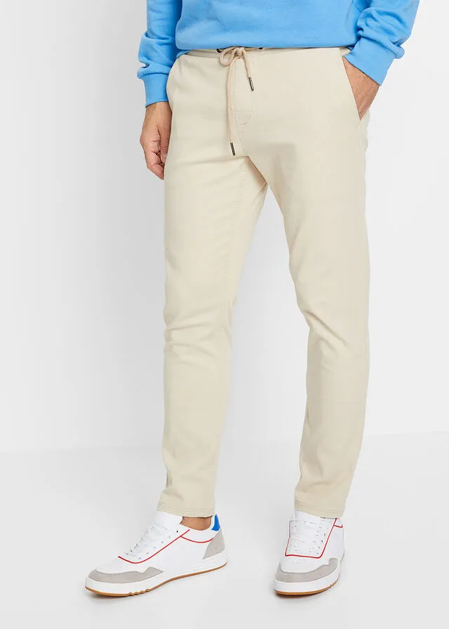 Pantalón chino elástico de corte regular, largo acortado y estilo tapered Arena claro
