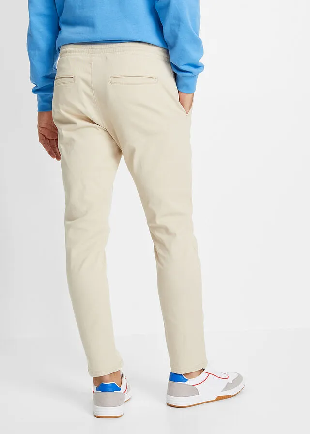 Pantalón chino elástico de corte regular, largo acortado y estilo tapered Arena claro