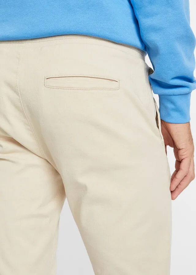 Pantalón chino elástico de corte regular, largo acortado y estilo tapered Arena claro