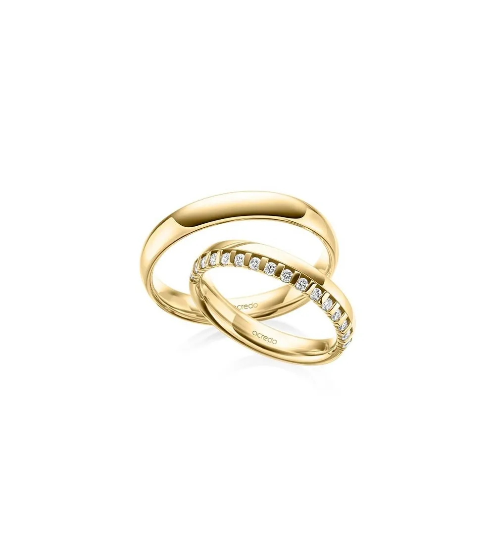 Preciosas alianzas de boda en oro amarillo con media corona de diamantes